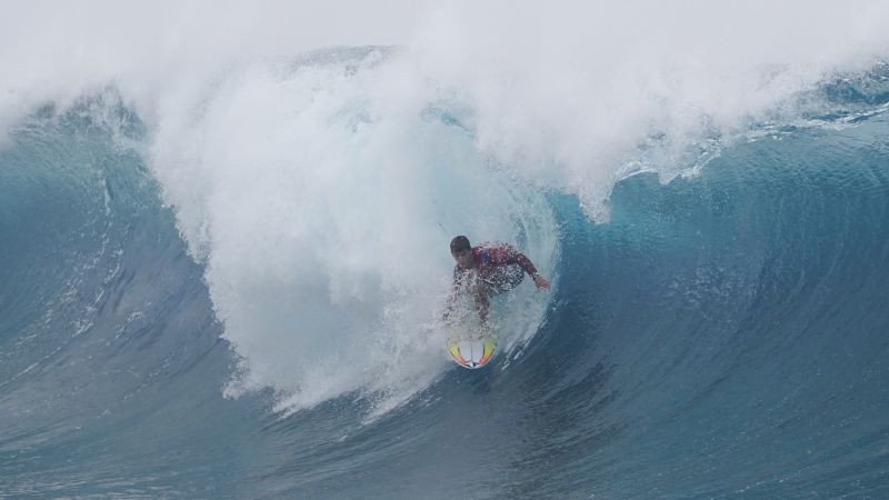 Aluminum tower construction in Tahiti for Olympic surf event paused after barge damages coral