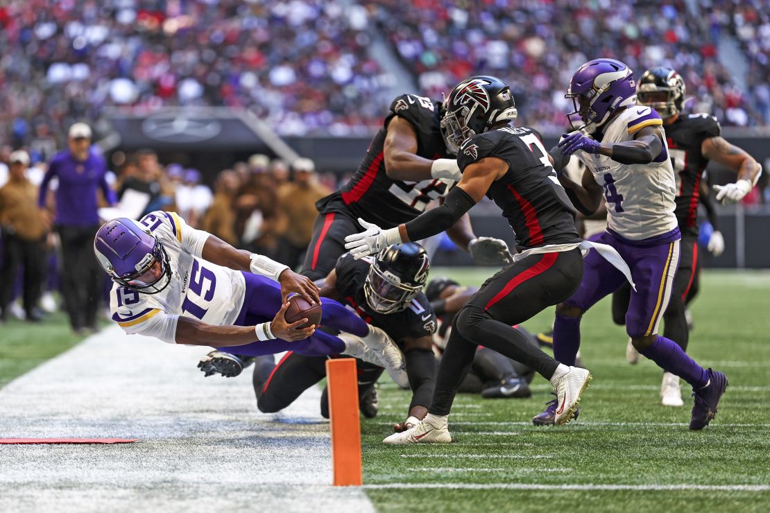 ATLANTA, GA - NOVEMBER 5: Joshua Dobbs #15 of the Minnesota Vikings reaches for the pylon during the second quarter of an NFL football game against the Atlanta Falcons at Mercedes-Benz Stadium on November 5, 2023 in Atlanta, Georgia. (Photo by Kevin Sabitus/Getty Images)