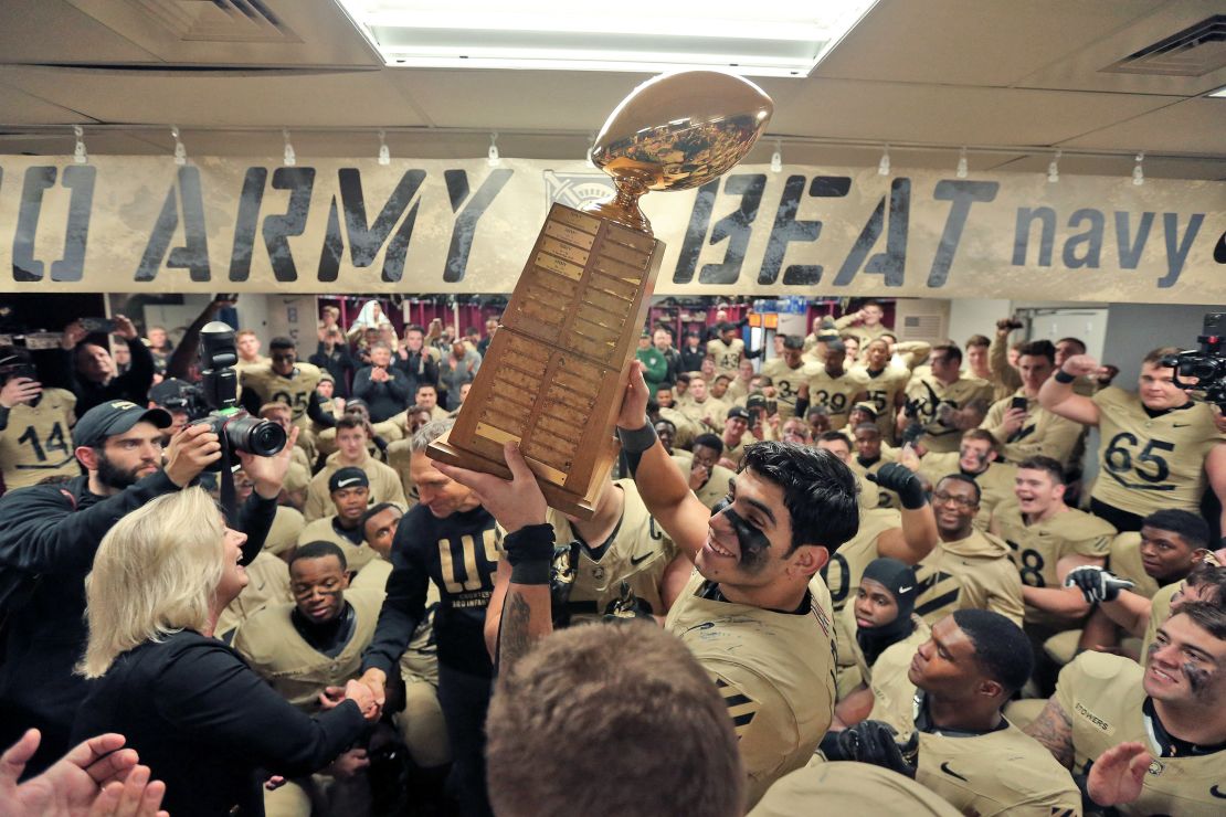 Dec 9, 2023; Foxborough, Massachusetts, USA; Army Black Knights linebacker Jimmy Ciarlo (7) holds the Secretary's Trophy after a 17-11 win against the Navy Midshipmen at the Army-Navy Game at Gillette Stadium.