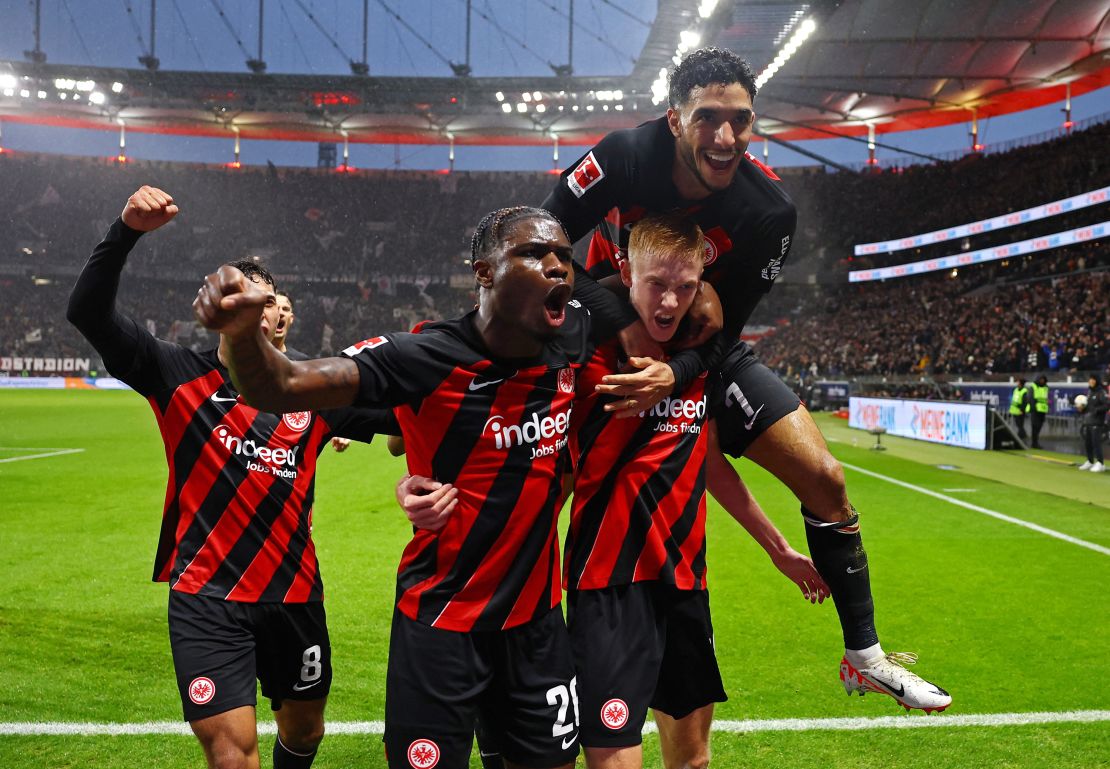 Soccer Football - Bundesliga - Eintracht Frankfurt v Bayern Munich - Deutsche Bank Park, Frankfurt, Germany - December 9, 2023
Eintracht Frankfurt's Hugo Larsson celebrates with Eric Junior Dina Ebimbe and Omar Marmoush after scoring their third goal