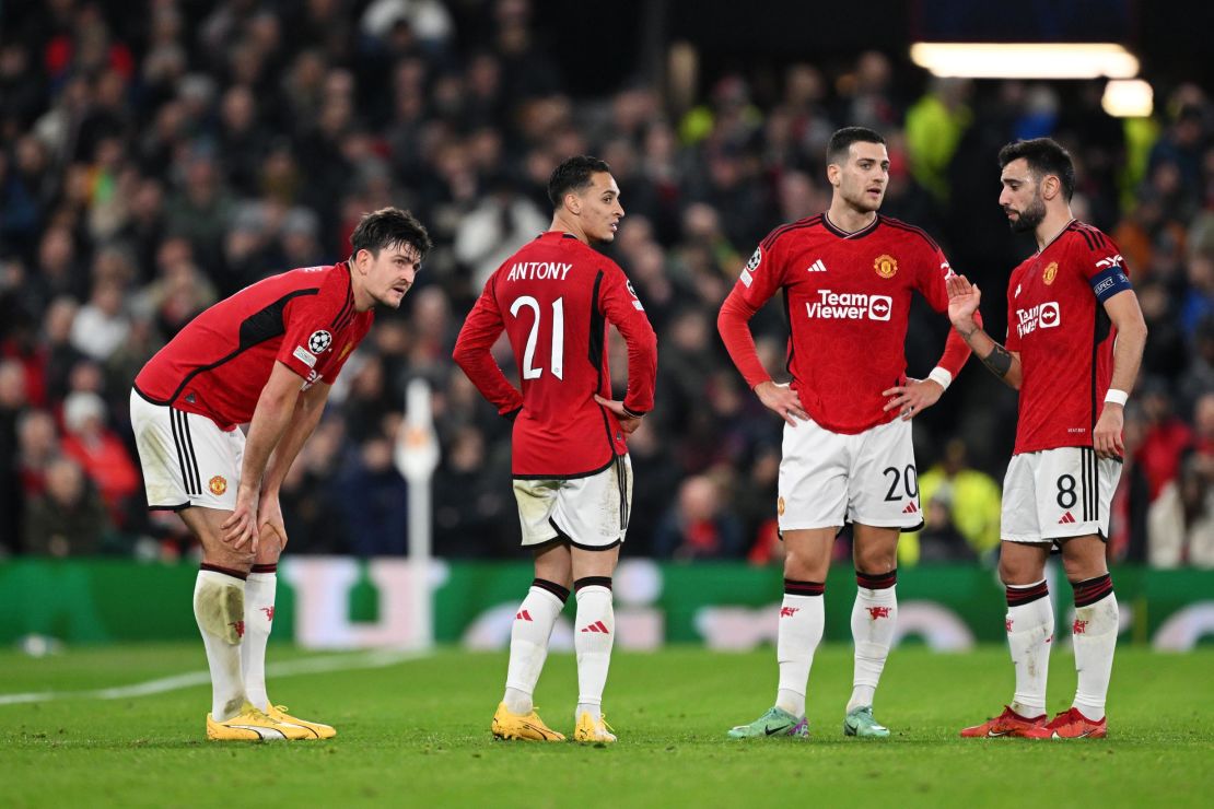 MANCHESTER, ENGLAND - DECEMBER 12: Harry Maguire of Manchester United reacts after suffering an injury during the UEFA Champions League match between Manchester United and FC Bayern München at Old Trafford on December 12, 2023 in Manchester, England. (Photo by Shaun Botterill/Getty Images)