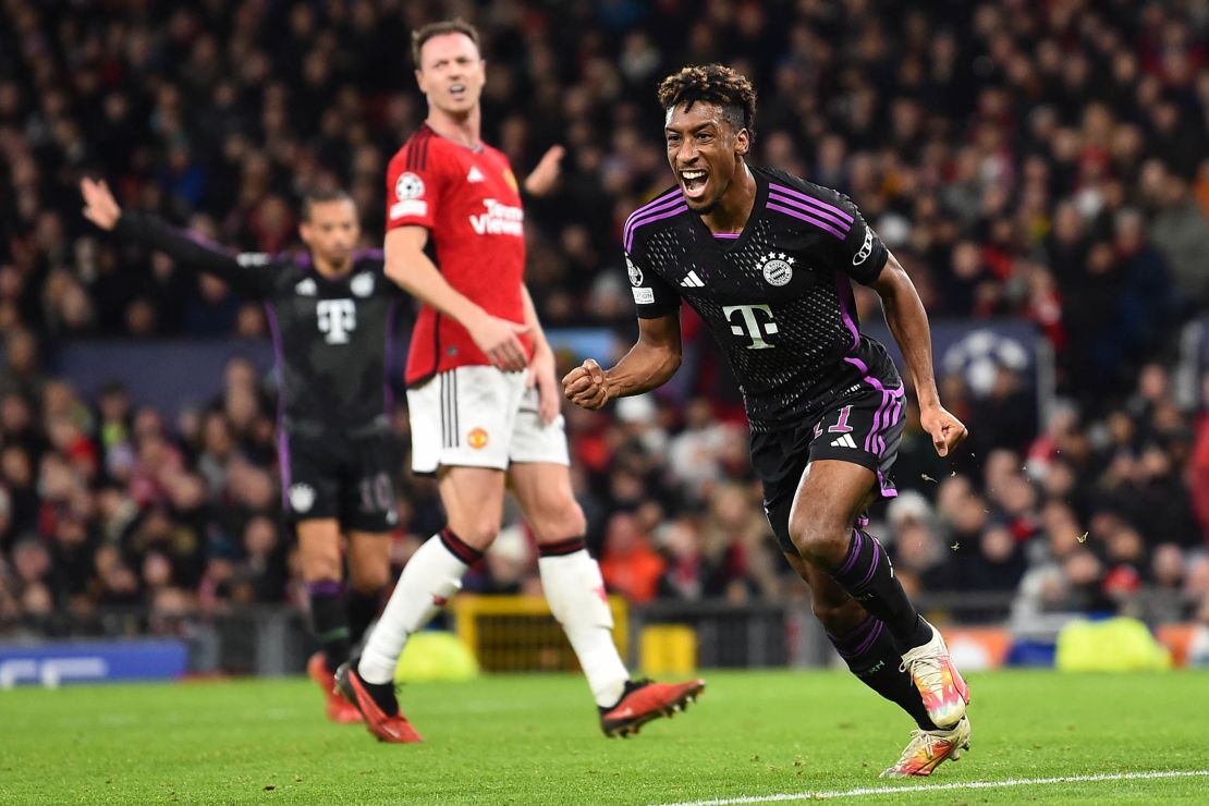 Bayern Munich's French forward #11 Kingsley Coman celebrates after scoring the team's first goal during the UEFA Champions League group A football match between Manchester United and FC Bayern Munich at Old Trafford stadium in Manchester, north west England, on December 12, 2023. (Photo by PETER POWELL / AFP) (Photo by PETER POWELL/AFP via Getty Images)