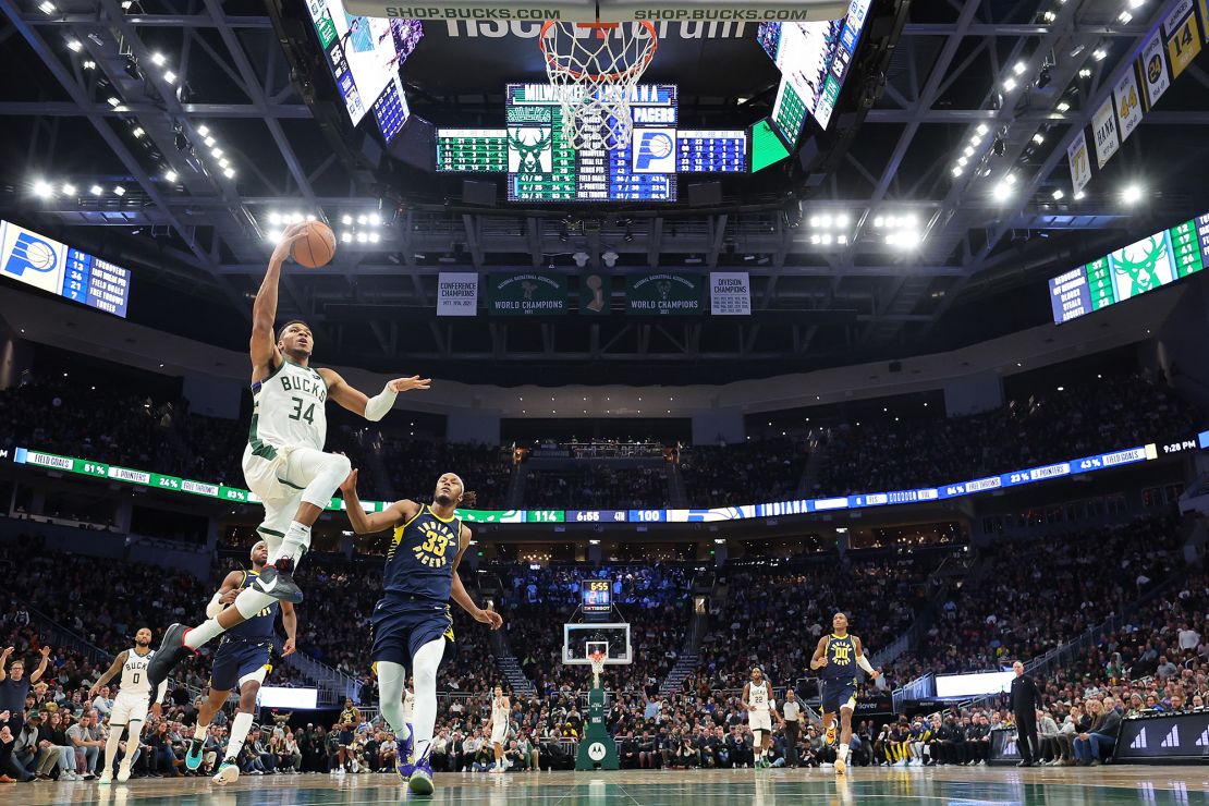 MILWAUKEE, WISCONSIN - DECEMBER 13: Giannis Antetokounmpo #34 of the Milwaukee Bucks drives to the basket against Myles Turner #33 of the Indiana Pacers during the second half of a game at Fiserv Forum on December 13, 2023 in Milwaukee, Wisconsin. NOTE TO USER: User expressly acknowledges and agrees that, by downloading and or using this photograph, User is consenting to the terms and conditions of the Getty Images License Agreement. (Photo by Stacy Revere/Getty Images)