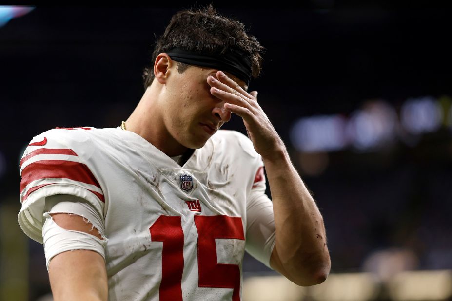 New York Giants quarterback Tommy DeVito walks off the field after losing 24-6 to the New Orleans Saints.