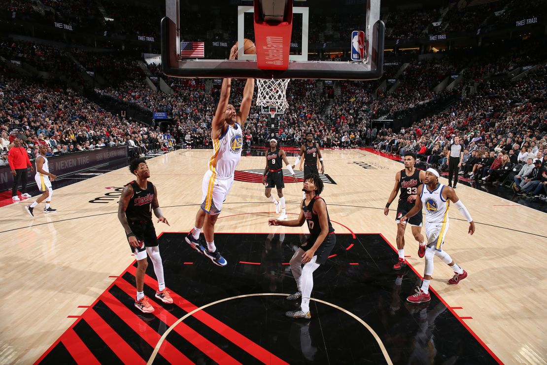 PORTLAND, OR - DECEMBER 17:  Trayce Jackson-Davis #32 of the Golden State Warriors  goes to the basket during the game on December 17, 2023 at the Moda Center Arena in Portland, Oregon. NOTE TO USER: User expressly acknowledges and agrees that, by downloading and or using this photograph, user is consenting to the terms and conditions of the Getty Images License Agreement. Mandatory Copyright Notice: Copyright 2023 NBAE (Photo by David Sherman/NBAE via Getty Images)