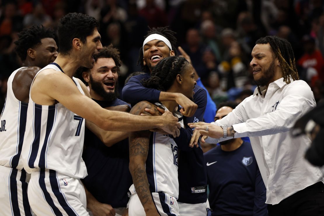 NEW ORLEANS, LOUISIANA - DECEMBER 19: Ja Morant #12 of the Memphis Grizzlies reacts with his team after defeating the New Orleans Pelicans at Smoothie King Center on December 19, 2023 in New Orleans, Louisiana.  NOTE TO USER: User expressly acknowledges and agrees that, by downloading and or using this photograph, User is consenting to the terms and conditions of the Getty Images License Agreement. (Photo by Chris Graythen/Getty Images)