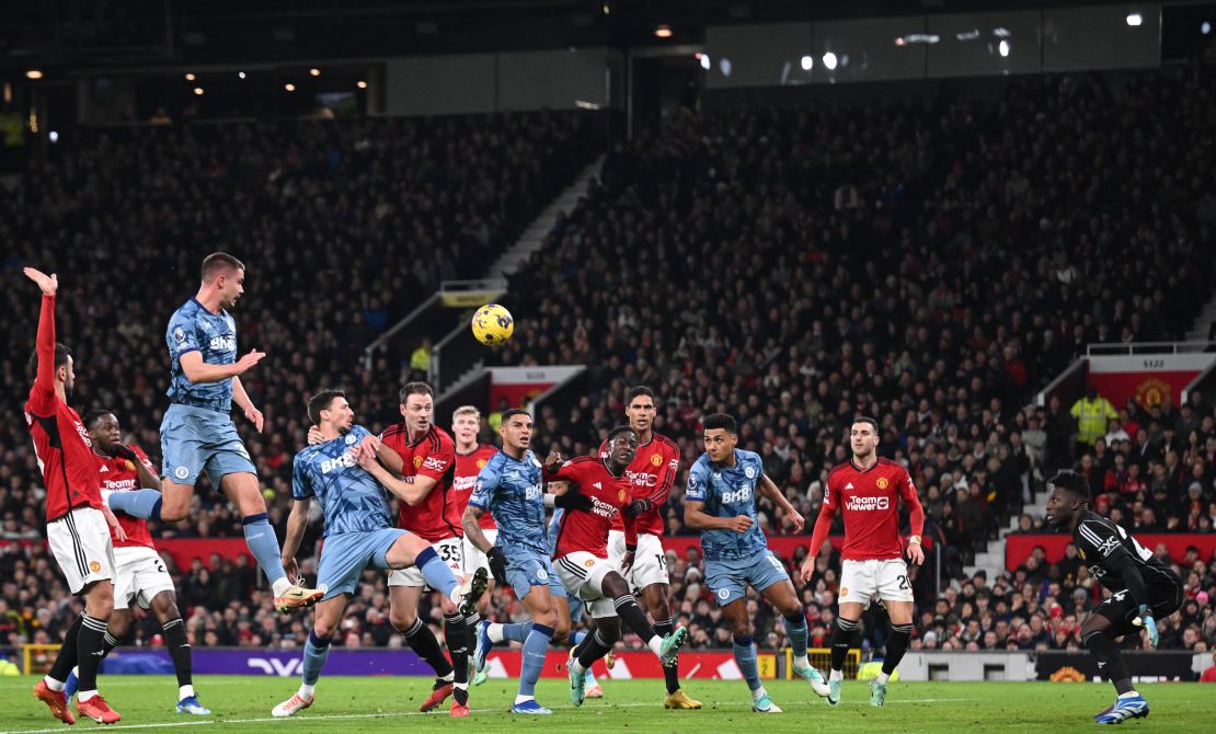 A freekick from Aston Villa's Scottish midfielder #07 John McGinn evades all players to go directly into the United goal for the opening goal of the English Premier League football match between Manchester United and Aston Villa at Old Trafford in Manchester, north west England, on December 26, 2023. (Photo by Oli SCARFF / AFP) / RESTRICTED TO EDITORIAL USE. No use with unauthorized audio, video, data, fixture lists, club/league logos or 'live' services. Online in-match use limited to 120 images. An additional 40 images may be used in extra time. No video emulation. Social media in-match use limited to 120 images. An additional 40 images may be used in extra time. No use in betting publications, games or single club/league/player publications. /