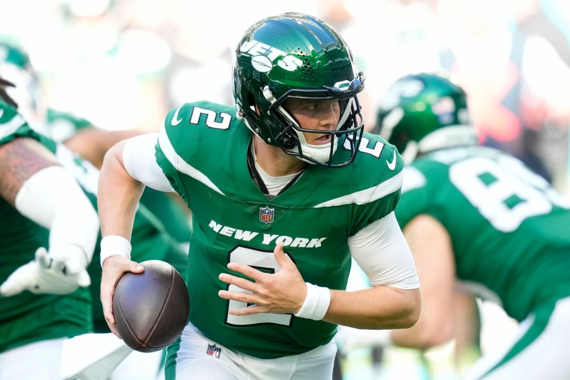 New York Jets quarterback Zach Wilson (2) scrambles with the ball during the first half of an NFL football game against the Miami Dolphins, Sunday, Dec. 17, 2023, in Miami Gardens, Fla.