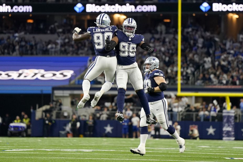 Dallas Cowboys defensive end DeMarcus Lawrence and Chauncey Golston celebrate during the first half the Cowboys' game against the Detroit Lions on Saturday, December 30. The <a href="https://www.cnn.com/2023/12/31/sport/dallas-cowboys-detroit-lions-nfl-spt-intl/index.html" target="_blank">Cowboys beat the Lions</a> 20-19.