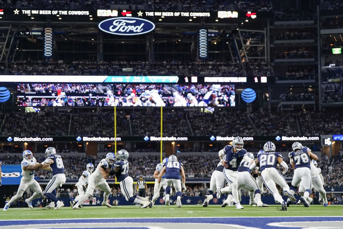 Dallas Cowboys quarterback Dak Prescott (4) hands off to running back Tony Pollard (20) during the first half of an NFL football game against the Detroit Lions, Saturday, Dec. 30, 2023, in Arlington, Texas. (AP Photo/Sam Hodde)