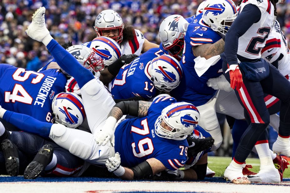 Josh Allen of the Buffalo Bills scores a touchdown during a game against the New England Patriots on December 31. The Bills would go on to beat the Patriots 27-21.