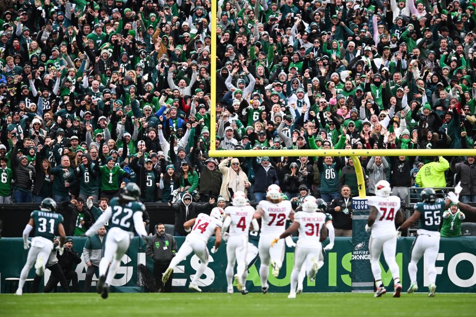 Fans react as the Philadelphia Eagles score a touchdown against the Arizona Cardinals in Philadelphia on December 31. The Cardinals beat the Eagles 35-31.