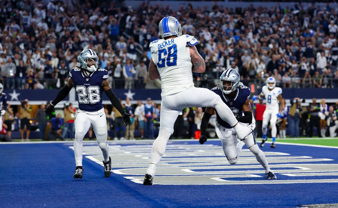 Dec 30, 2023; Arlington, Texas, USA;  Detroit Lions offensive tackle Taylor Decker (68) catches a two point conversion that was overturned by a penalty during the fourth quarter against the Dallas Cowboys at AT&T Stadium. Mandatory Credit: Kevin Jairaj-USA TODAY Sports