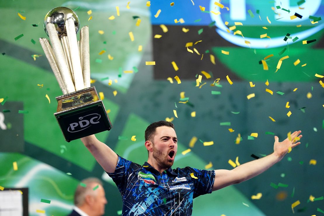 Luke Humphries celebrates with the trophy after beating Luke Littler in the final of the Paddy Power World Darts Championship at Alexandra Palace, London. Picture date: Wednesday January 3, 2024. (Photo by Zac Goodwin/PA Images via Getty Images)