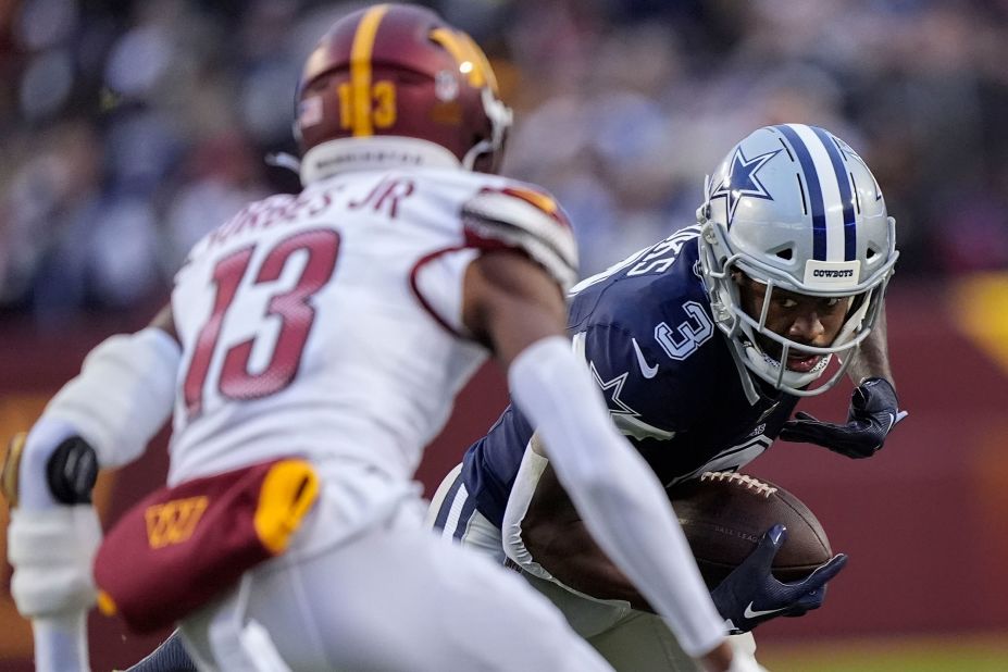 Dallas Cowboys wide receiver Brandin Cooks eyes Washington Commanders cornerback Emmanuel Forbes during the Cowboys' 38-10 victory on January 7. With the win, the Cowboys clinched the NFC East title and the No. 2 seed in the conference playoffs.