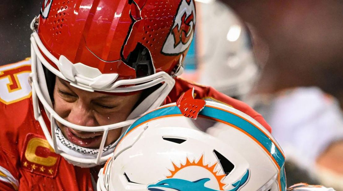 The helmet of Kansas City Chiefs quarterback Patrick Mahomes breaks while being hit by Miami Dolphins safety DeShon Elliott during the <a href="https://www.cnn.com/2024/01/14/sport/kansas-city-chiefs-defeat-miami-dolphins-cold/index.html" target="_blank">Chiefs' 26-7 victory over the Dolphins</a> on Saturday, January 13, in Kansas City, Missouri. The temperature at kickoff was -4 degrees Fahrenheit with a wind chill of -20 degrees, <a href="https://www.cnn.com/2024/01/13/weather/coldest-nfl-games-trnd/index.html" target="_blank">making it the fourth coldest game in National Football League history</a>, according to the Peacock broadcast.