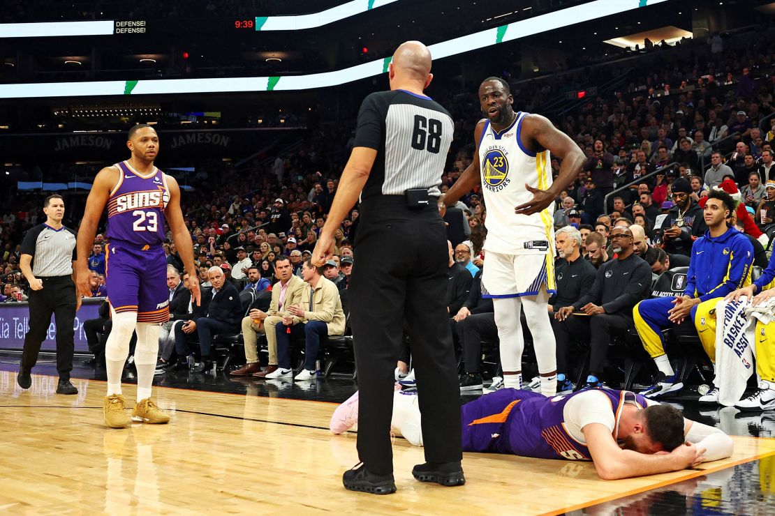 Dec 12, 2023; Phoenix, Arizona, USA; Golden State Warriors forward Draymond Green (23) reacts after being called for a foul on Phoenix Suns center Jusuf Nurkic (20) during the third quarter at Footprint Center. Mandatory Credit: Mark J. Rebilas-USA TODAY Sports