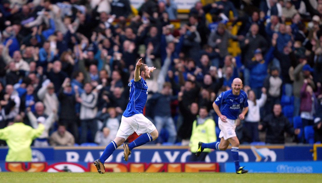 Everton's Wayne Rooney celebrates scoring the winning goal against Arsenal in front of the Everton fans  (Photo by Mike Egerton/EMPICS via Getty Images)