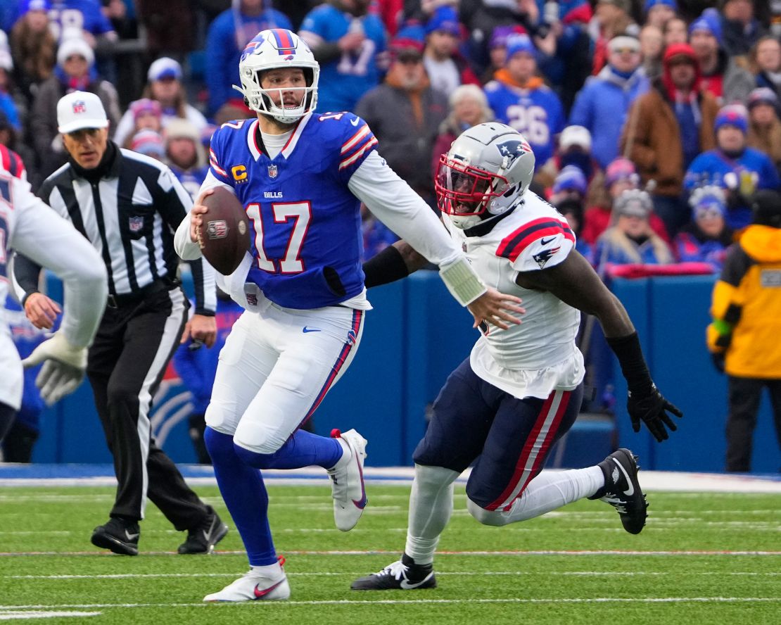 Dec 31, 2023; Orchard Park, New York, USA; Buffalo Bills quarterback Josh Allen (17) rolls out looking to throw the ball during the first half at Highmark Stadium.