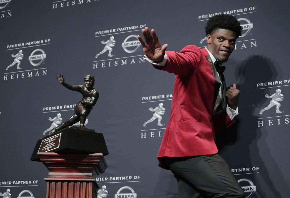 In this Saturday, Dec. 10, 2016, file photo, Louisville's Lamar Jackson poses with the Heisman Trophy after winning the award, in New York. (AP Photo/Julie Jacobson, File)