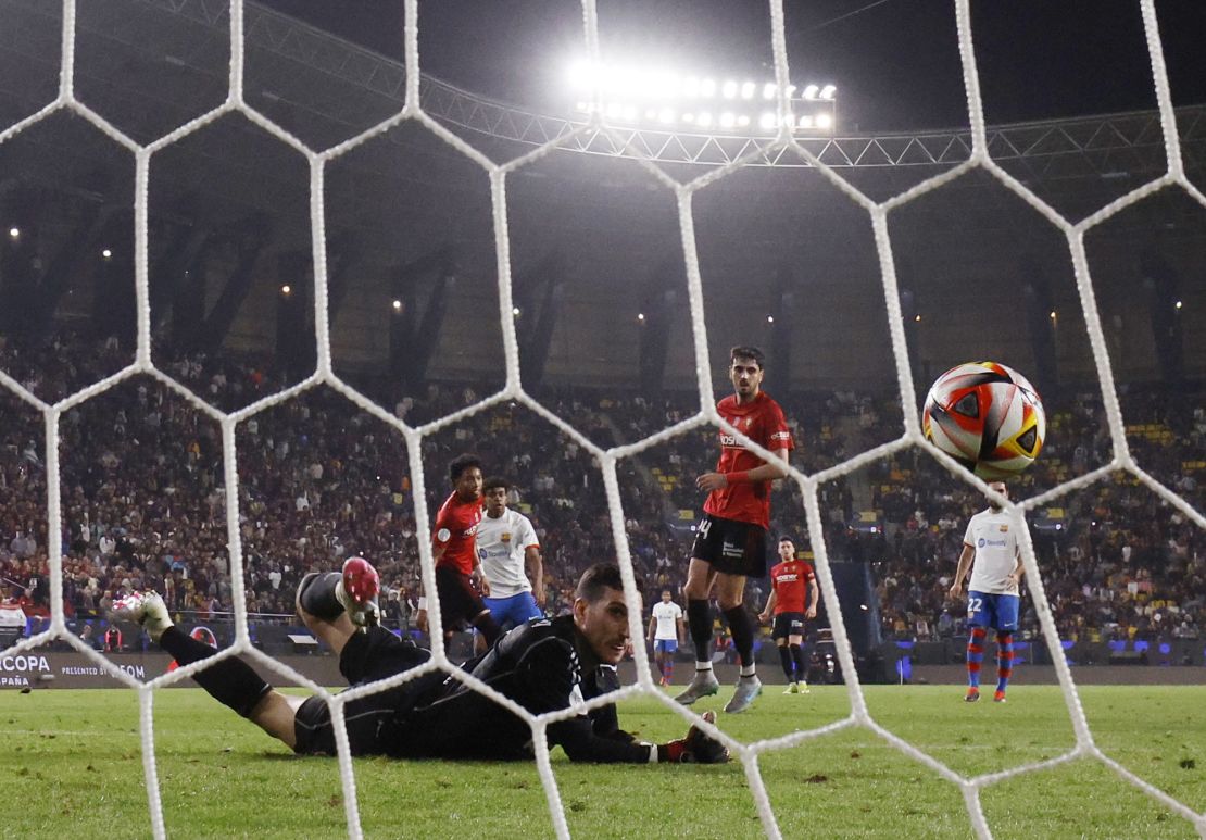 Soccer Football - Spanish Super Cup - Semi Final - FC Barcelona v Osasuna - Al-Awwal Park, Riyadh, Saudi Arabia - January 11, 2024
FC Barcelona's Lamine Yamal scores their second goal past Osasuna's Sergio Herrera REUTERS/Juan Medina