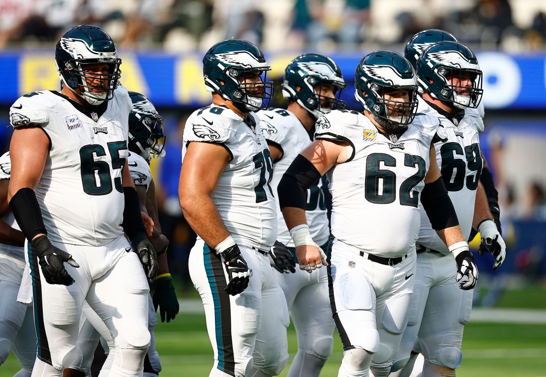 INGLEWOOD, CALIFORNIA - OCTOBER 08:   Lane Johnson #65, Jordan Mailata #68 and Jason Kelce #62 of the Philadelphia Eagles at SoFi Stadium on October 08, 2023 in Inglewood, California. (Photo by Ronald Martinez/Getty Images)