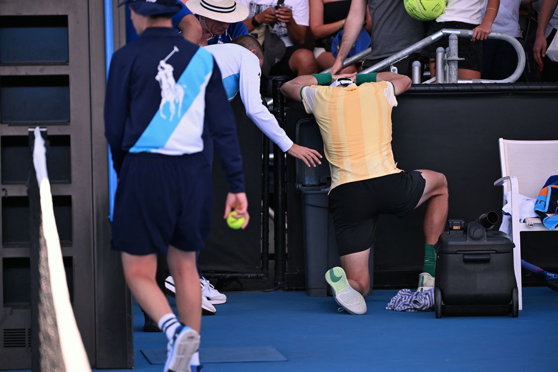 Britain's Jack Draper vomits after winning his men's singles match against USA's Marcos Giron on day three of the Australian Open tennis tournament in Melbourne on January 16, 2024. (Photo by WILLIAM WEST / AFP) / -- IMAGE RESTRICTED TO EDITORIAL USE - STRICTLY NO COMMERCIAL USE -- (Photo by WILLIAM WEST/AFP via Getty Images)