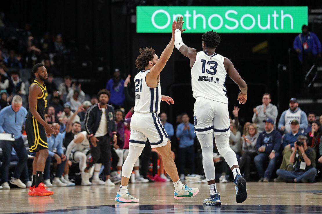 MEMPHIS, TENNESSEE - JANUARY 15: David Roddy #21 of the Memphis Grizzlies and Jaren Jackson Jr. #13 of the Memphis Grizzlies celebrate during the first half against the Golden State Warriors at FedExForum on January 15, 2024 in Memphis, Tennessee. NOTE TO USER: User expressly acknowledges and agrees that, by downloading and or using this photograph, User is consenting to the terms and conditions of the Getty Images License Agreement. (Photo by Justin Ford/Getty Images)