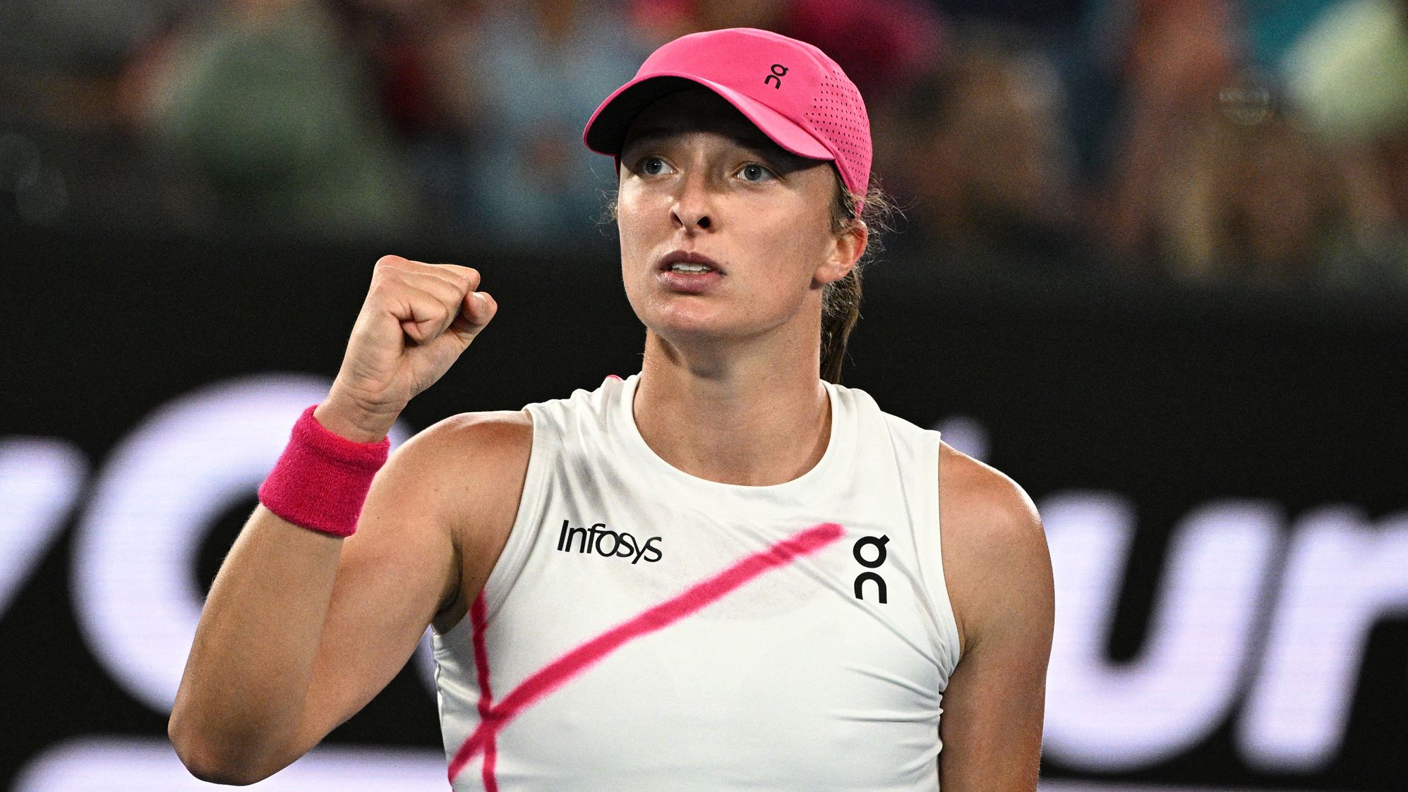 Poland's Iga Swiatek celebrates after victory against USA's Danielle Collins during their women's singles match on day five of the Australian Open tennis tournament in Melbourne on January 18, 2024. (Photo by Anthony WALLACE / AFP) / -- IMAGE RESTRICTED TO EDITORIAL USE - STRICTLY NO COMMERCIAL USE -- (Photo by ANTHONY WALLACE/AFP via Getty Images)