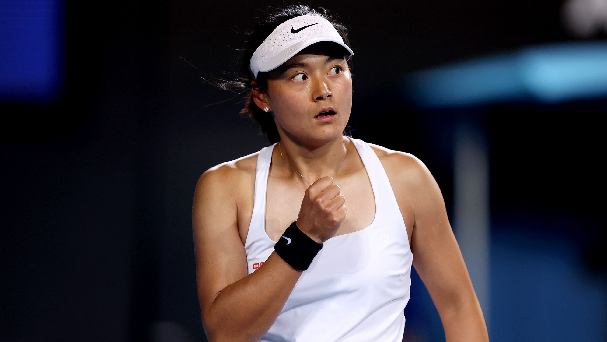 MELBOURNE, AUSTRALIA - JANUARY 18: Yafan Wang of China celebrates a point in their round two singles match against Emma Raducanu of Great Britain during the 2024 Australian Open at Melbourne Park on January 18, 2024 in Melbourne, Australia. (Photo by Julian Finney/Getty Images)