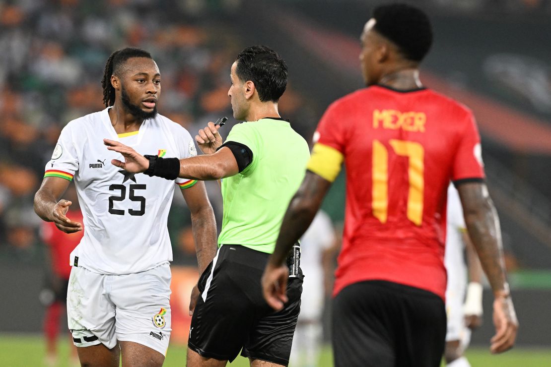 Ghana's forward #25 Antoine Semenyo speaks to Libyan referee Ibrahim Mutaz during the Africa Cup of Nations (CAN) 2024 group B football match between Mozambique and Ghana at Alassane Ouattara Olympic Stadium in Ebimpe, Abidjan on January 22, 2024. (Photo by Issouf SANOGO / AFP) (Photo by ISSOUF SANOGO/AFP via Getty Images)