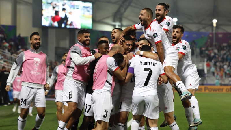 Palestinian soccer team claims emotional first Asian Cup win to reach knockouts as war rages in Gaza