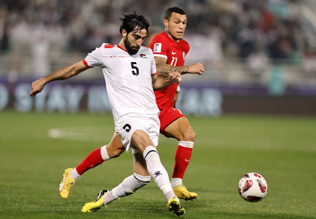 Soccer Football - AFC Asian Cup - Group C - Hong Kong v Palestine - Abdullah bin Khalifa Stadium, Doha, Qatar - January 23, 2024
Palestine's Mohammed Saleh in action with Hong Kong's Everton Camargo REUTERS/Thaier Al-Sudani