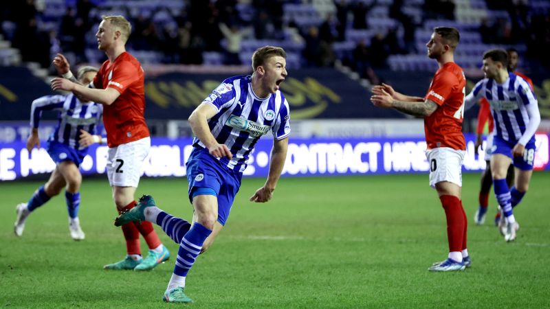 Wigan’s Charlie Hughes nets late, late winner to make soccer history