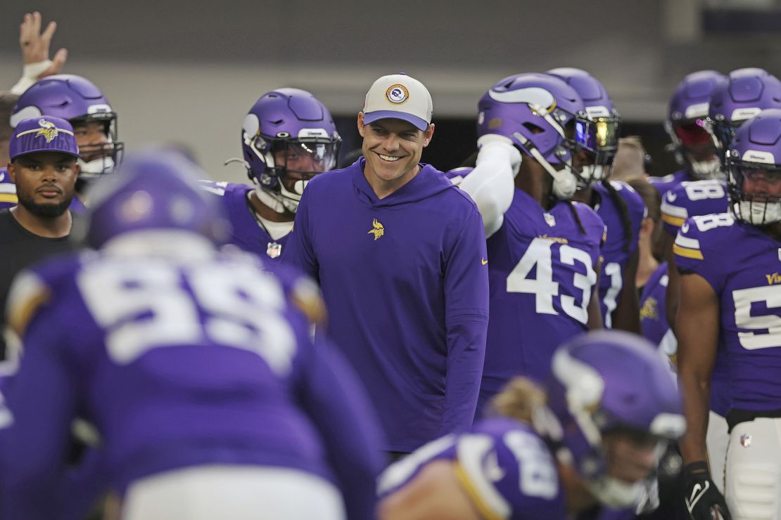 Minnesota Vikings head coach Kevin O'Connell smiles with players during warm ups before an NFL football game against the Tennessee Titans, Saturday, Aug. 19, 2023 in Minneapolis. (AP Photo/Stacy Bengs)