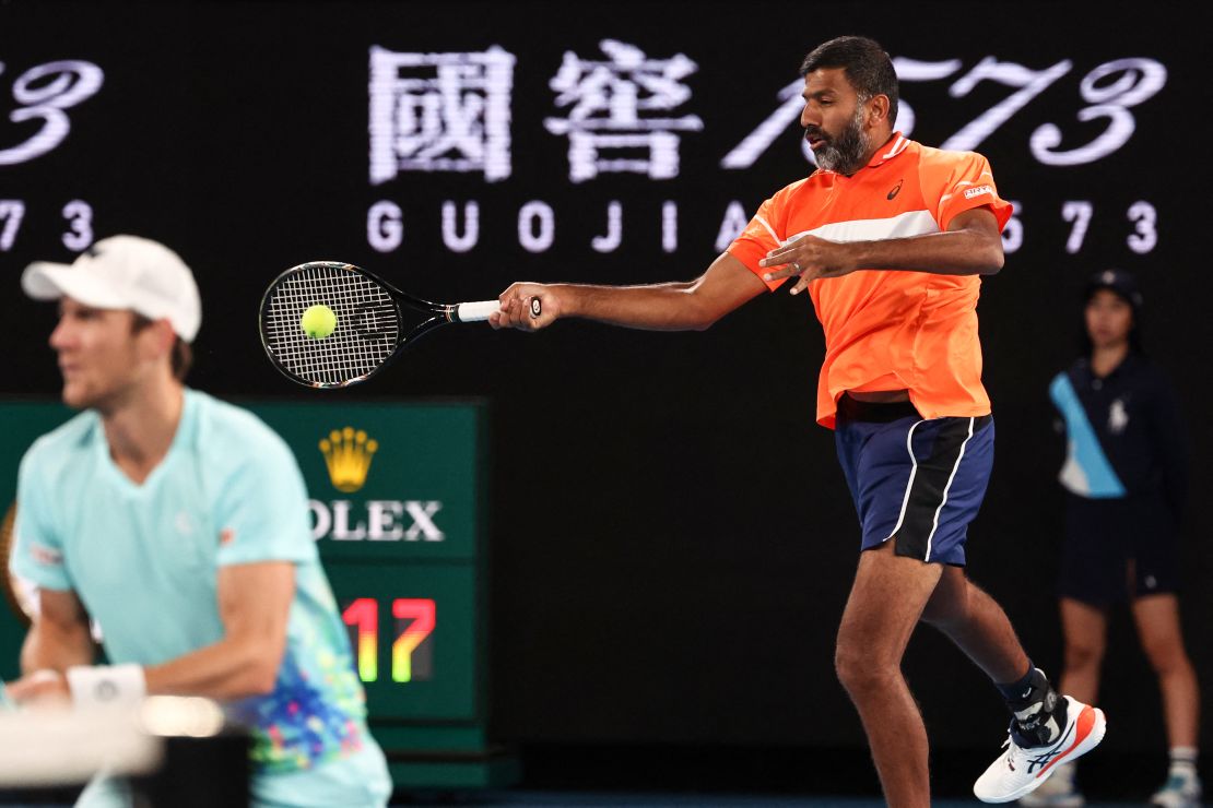 India's Rohan Bopanna (R) and Australia's Matthew Ebden play a point against Italy's Simone Bolelli and Andrea Vavassori during their men's doubles final match on day 14 of the Australian Open tennis tournament in Melbourne on January 27, 2024.