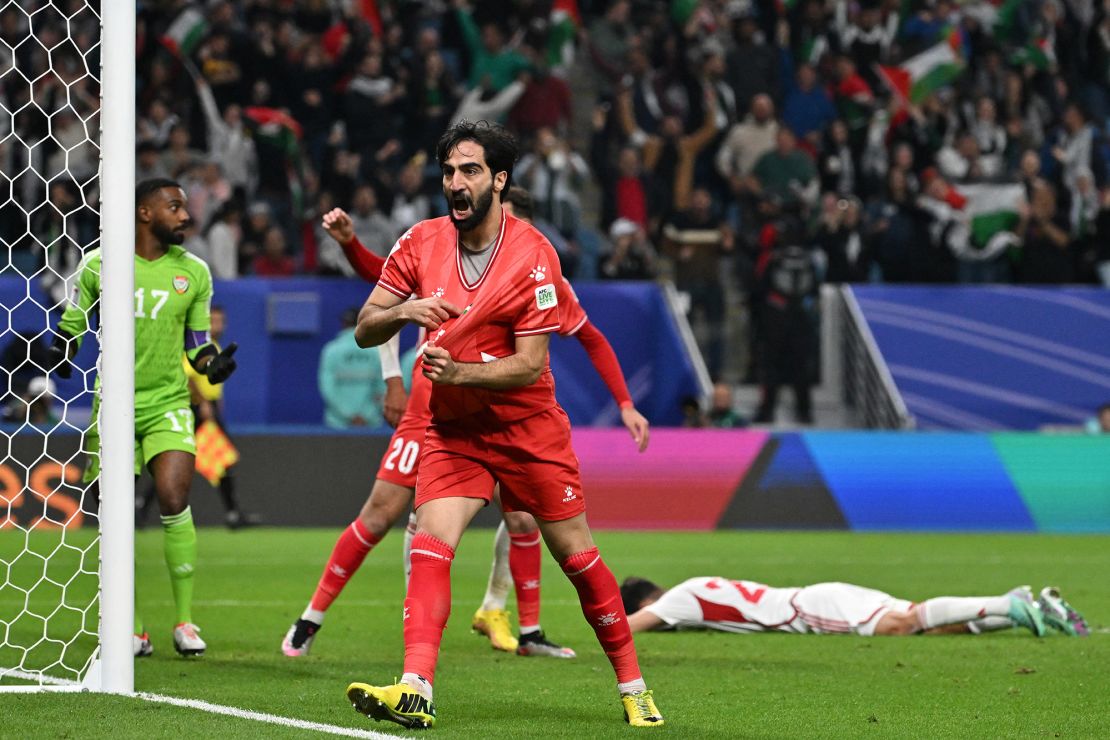 Palestine's defender #05 Mohammed Saleh celebrates after UAE conceded an own goal during the Qatar 2023 AFC Asian Cup Group C football match between Palestine and United Arab Emirates at the Al-Janoub Stadium in Al-Wakrah, south of Doha on January 18, 2024. (Photo by HECTOR RETAMAL / AFP) (Photo by HECTOR RETAMAL/AFP via Getty Images)