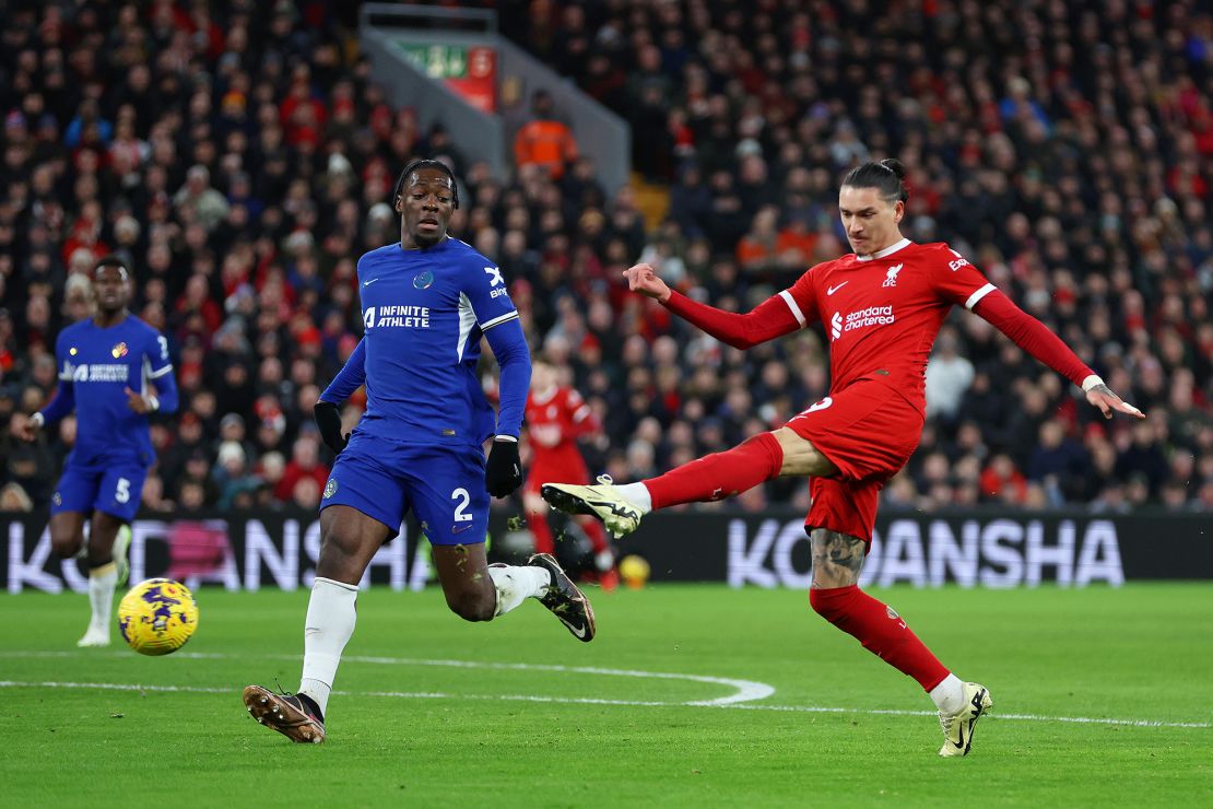 LIVERPOOL, ENGLAND - JANUARY 31: Darwin Nunez of Liverpool shoots whilst under pressure from Axel Disasi of Chelsea during the Premier League match between Liverpool FC and Chelsea FC at Anfield on January 31, 2024 in Liverpool, England. (Photo by Clive Brunskill/Getty Images)