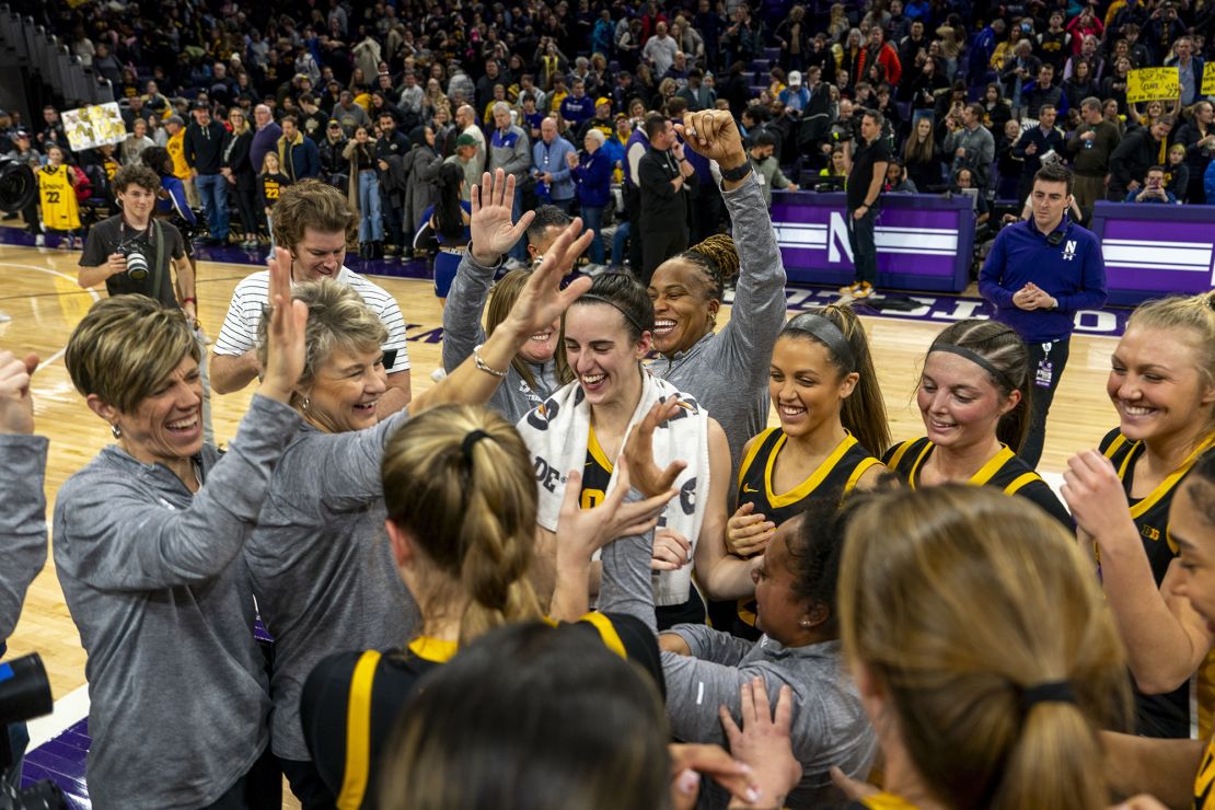 EVANSTON, IL - JANUARY 31: the Iowa Hawkeyes Women's Basketball team, including Iowa Hawkeyes guard Caitlin Clark (22) and Iowa Hawkeyes head coach Lisa Bluder, celebrate their win against the Northwestern Wildcats after the college basketball game between the Iowa Hawkeyes and the Northwestern Wildcats on January 31, 2024, at Welsh-Ryan Arena in Evanston, IL. (Photo by Ben Hsu/Icon Sportswire) (Icon Sportswire via AP Images)