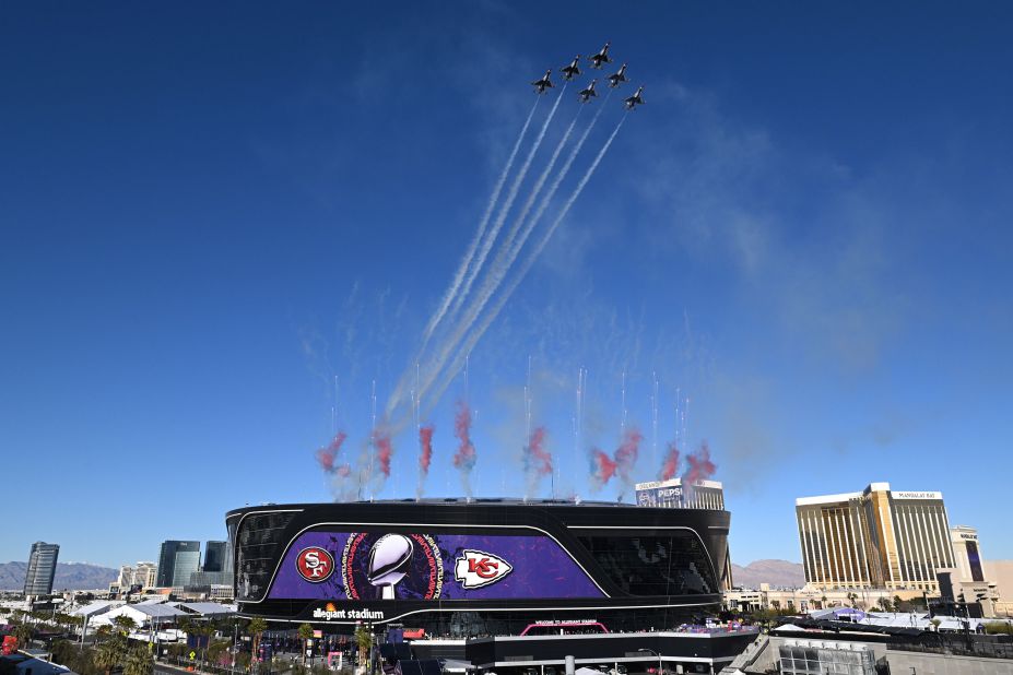 Planes fly over Allegiant Stadium before the game.