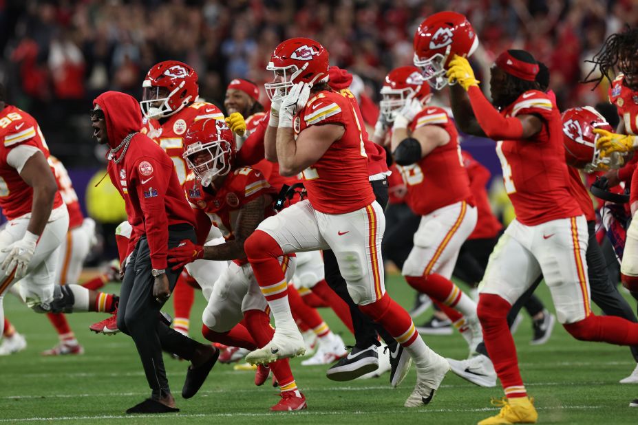 Chiefs players run onto the field after the game-winning touchdown.