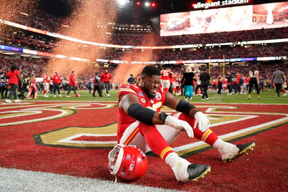 Chiefs guard Trey Smith cries on the field after his team won the game.