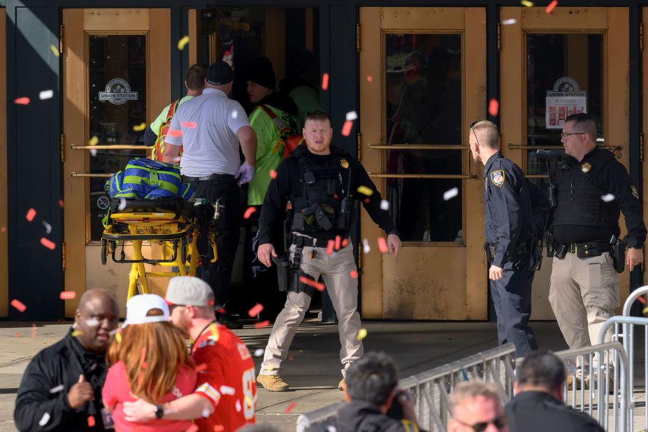 Emergency personnel take a stretcher into Union Station.