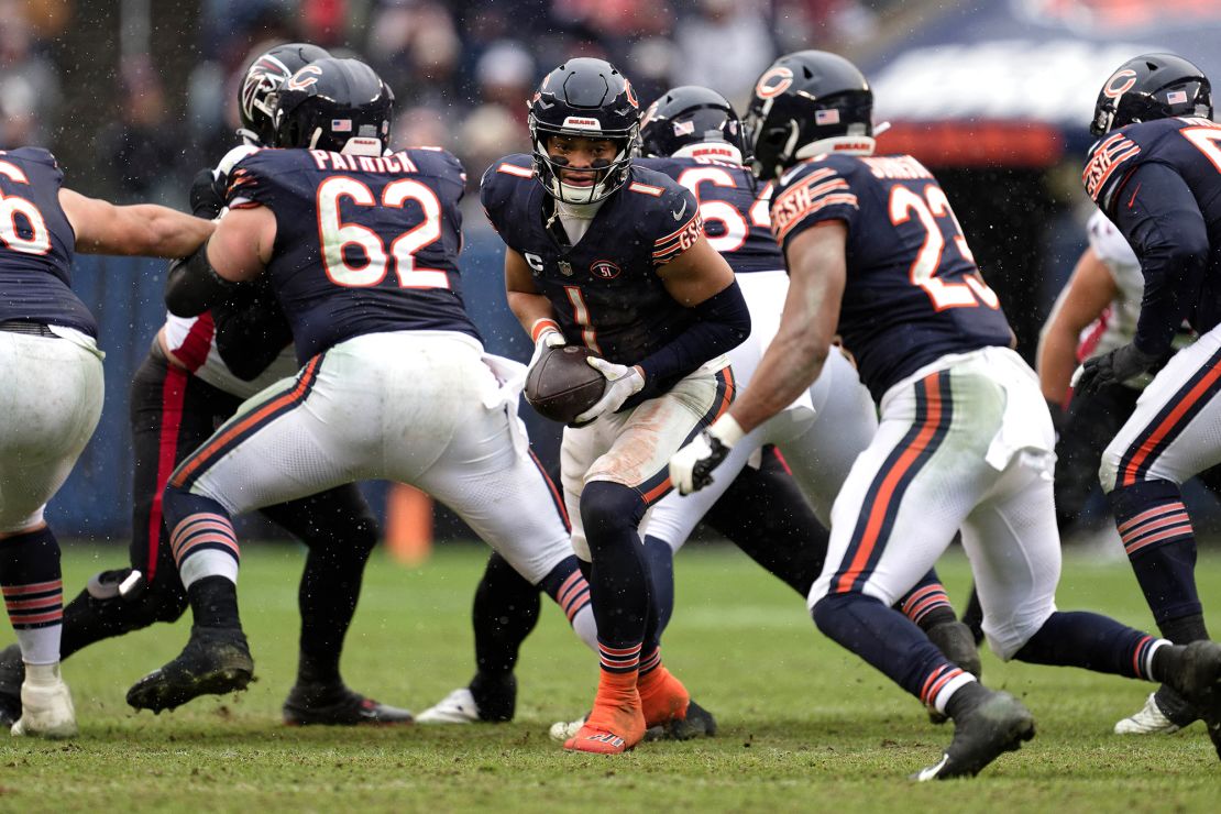 Fields hands off the ball during the Bears' game against the Atlanta Falcons.