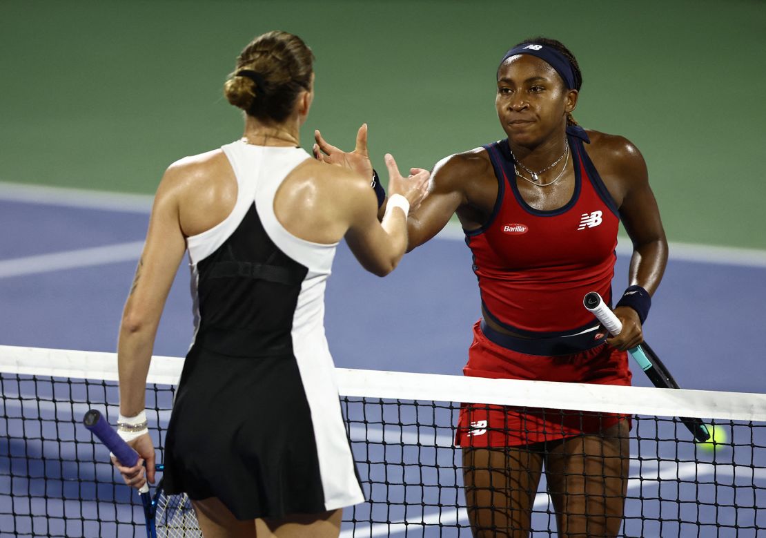 Gauff hand Plíšková shake hands after their match.