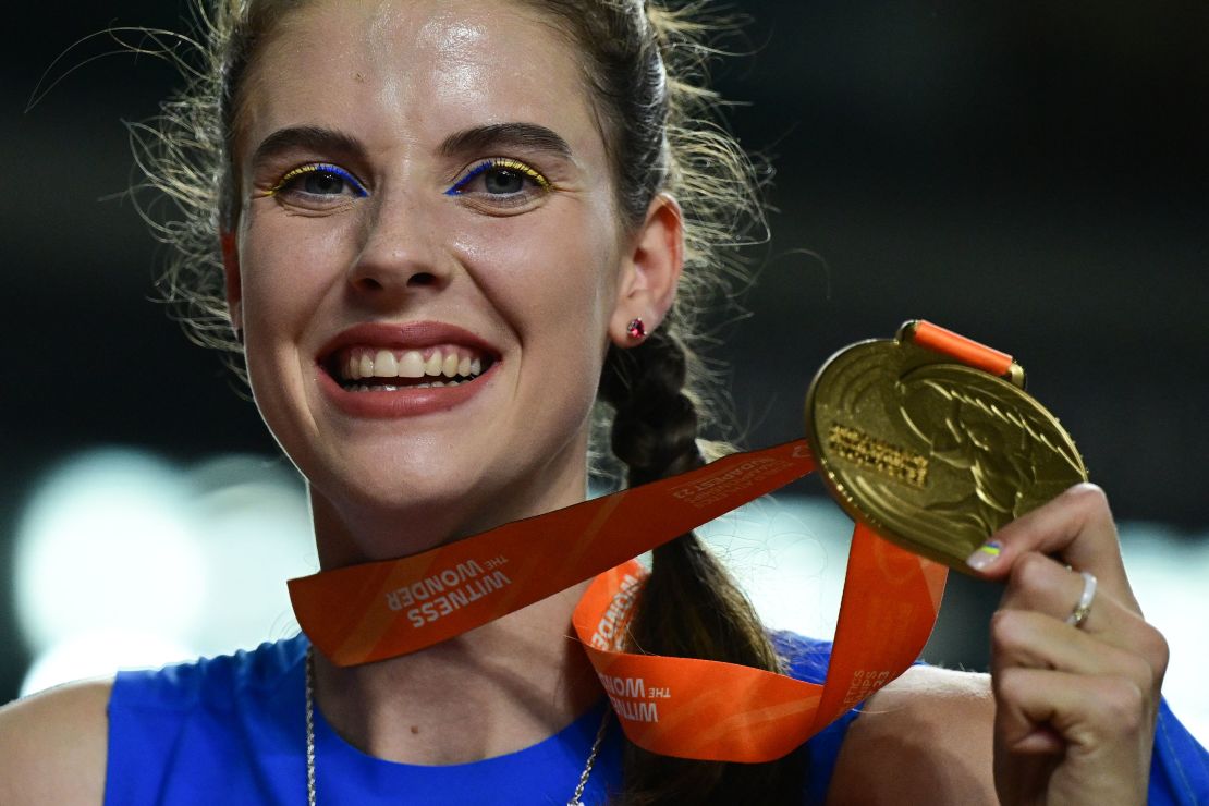 TOPSHOT - Gold medalist, Ukraine's Yaroslava Mahuchikh celebrates with her medal after the women's high jump final during the World Athletics Championships at the National Athletics Centre in Budapest on August 27, 2023. (Photo by Ben Stansall / AFP) (Photo by BEN STANSALL/AFP via Getty Images)