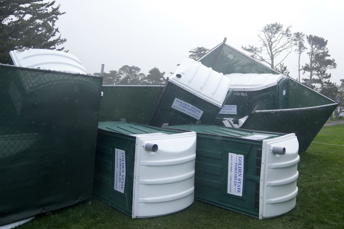 Fallen portable toilets at Pebble Beach on Sunday.