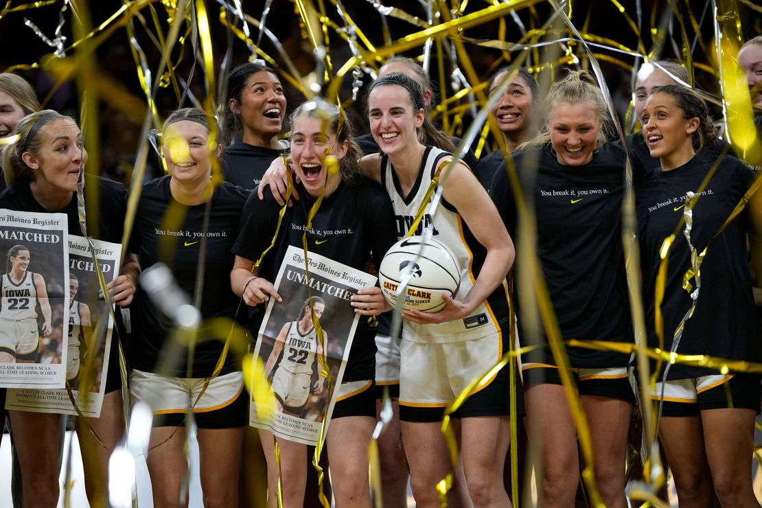 Clark celebrates with her teammates after breaking Kelsey Plum's scoring record.