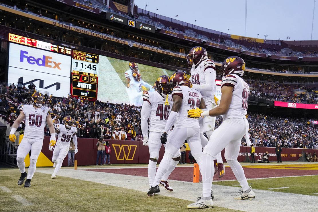 Commanders players celebrate against the Dallas Cowboys in January.