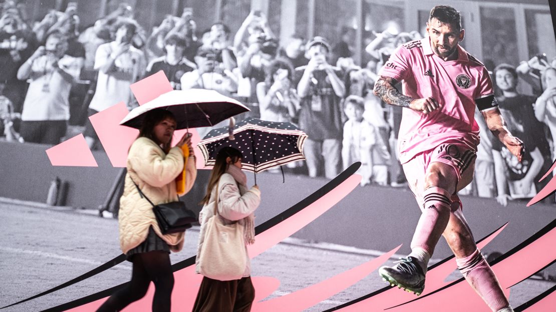 Pedestrians walk past an advertisement for Inter Miami's match in Tokyo on February 5, 2024